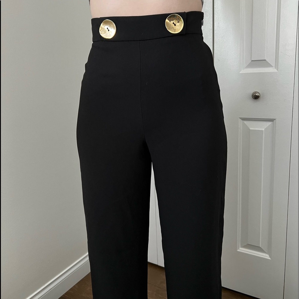 High waisted black wide leg trousers with gold button detail